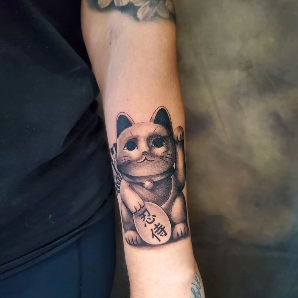 Cartoon cat tattoo by Adrian Castro
