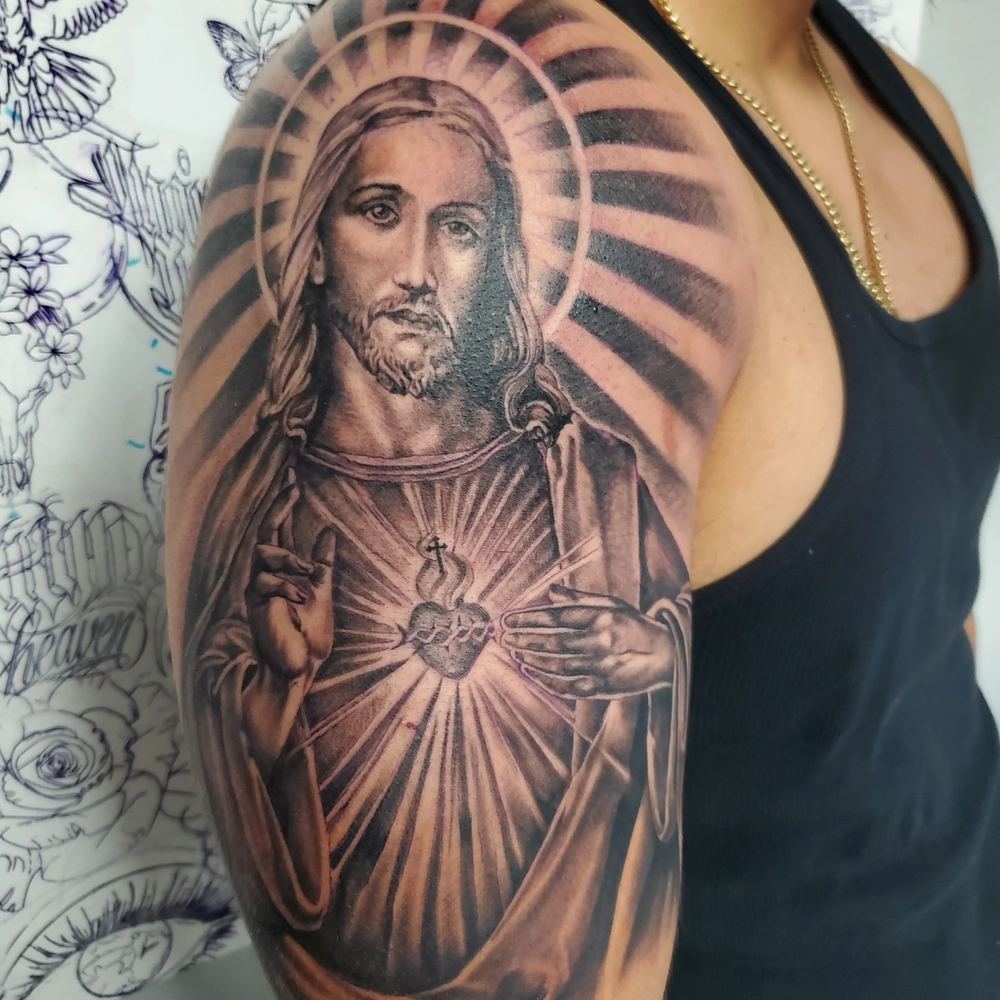 Sacred heart tattoo by Adrian Castro