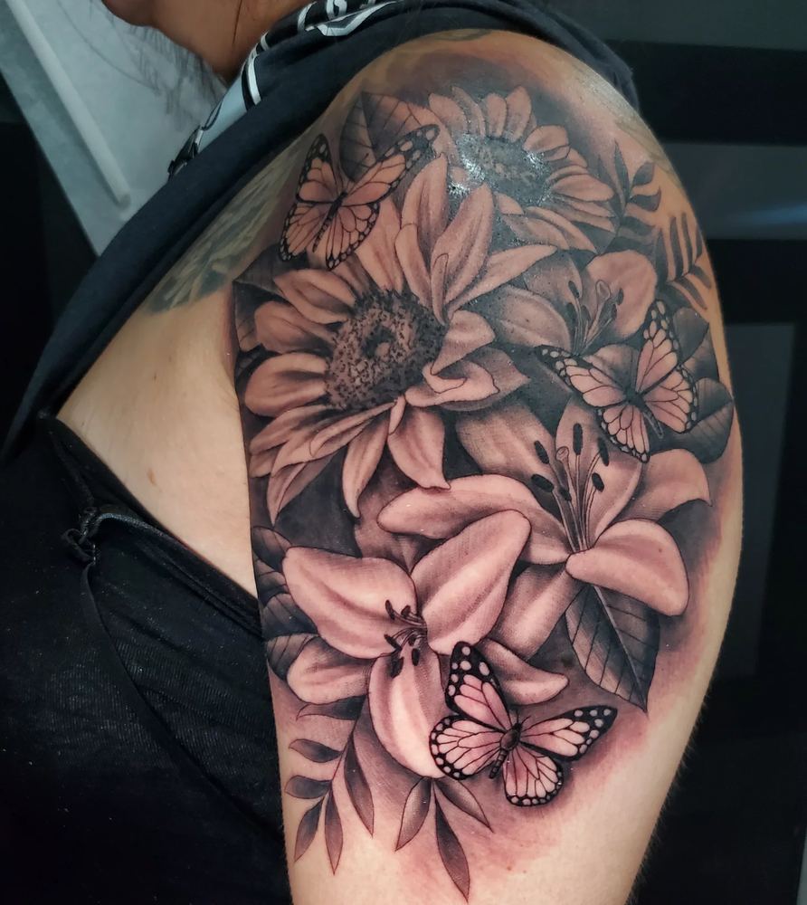 Lilies & butterfly tattoo by Adrian Castro