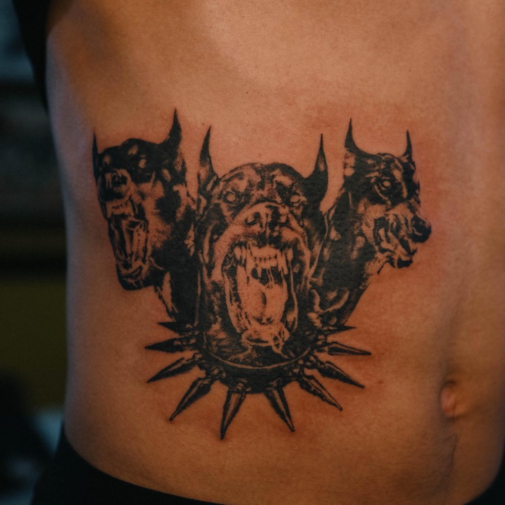 Dogs & emblem tattoo by Ash Barroga