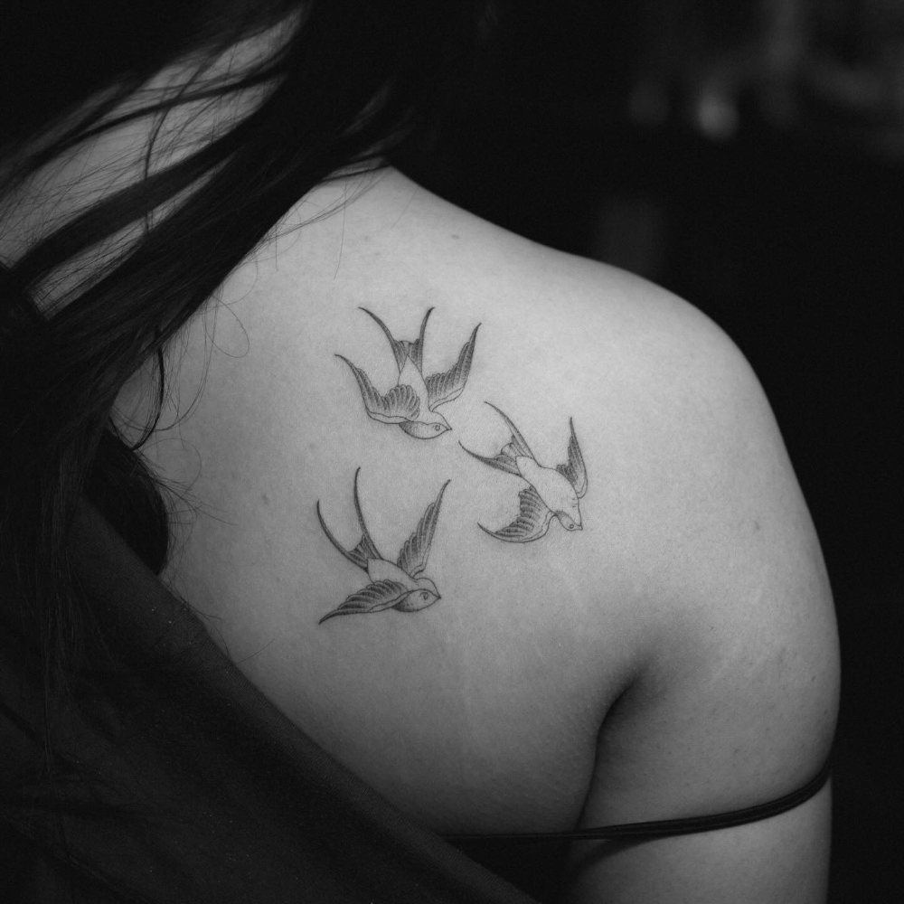 Swallows tattoo by Ash Barroga