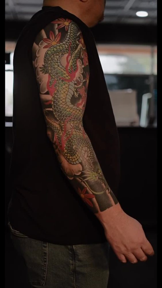 Dragon sleeve tattoo by Bryan Adam