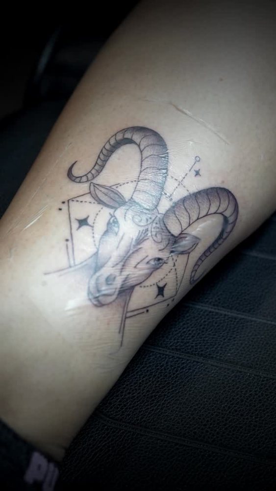 Ram head tattoo by Bryan Adam
