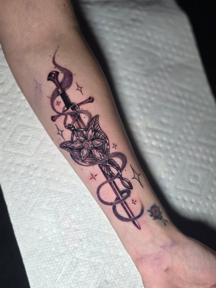 Matching sword tattoo by Chase