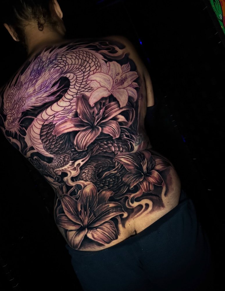 Dragon & flowers tattoo by Chase