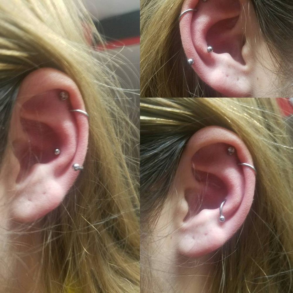 Conch piercing by Doni