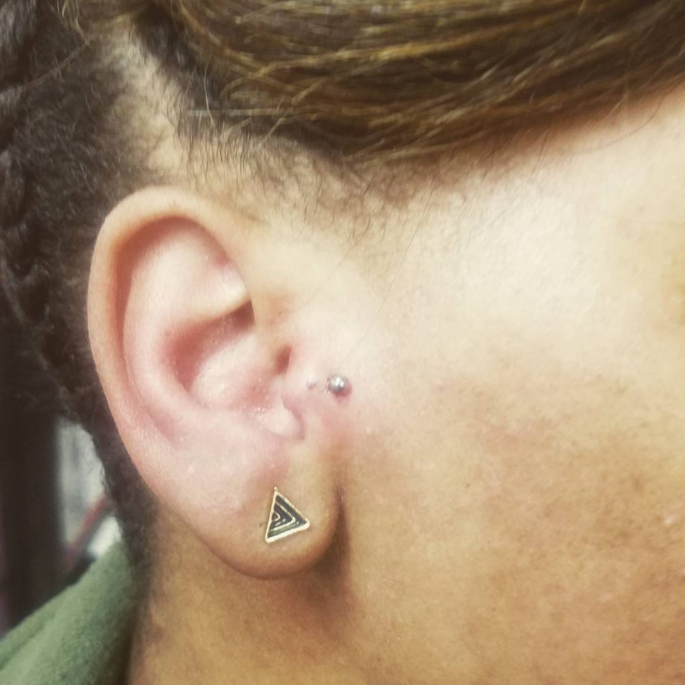 Tragus piercing by Doni