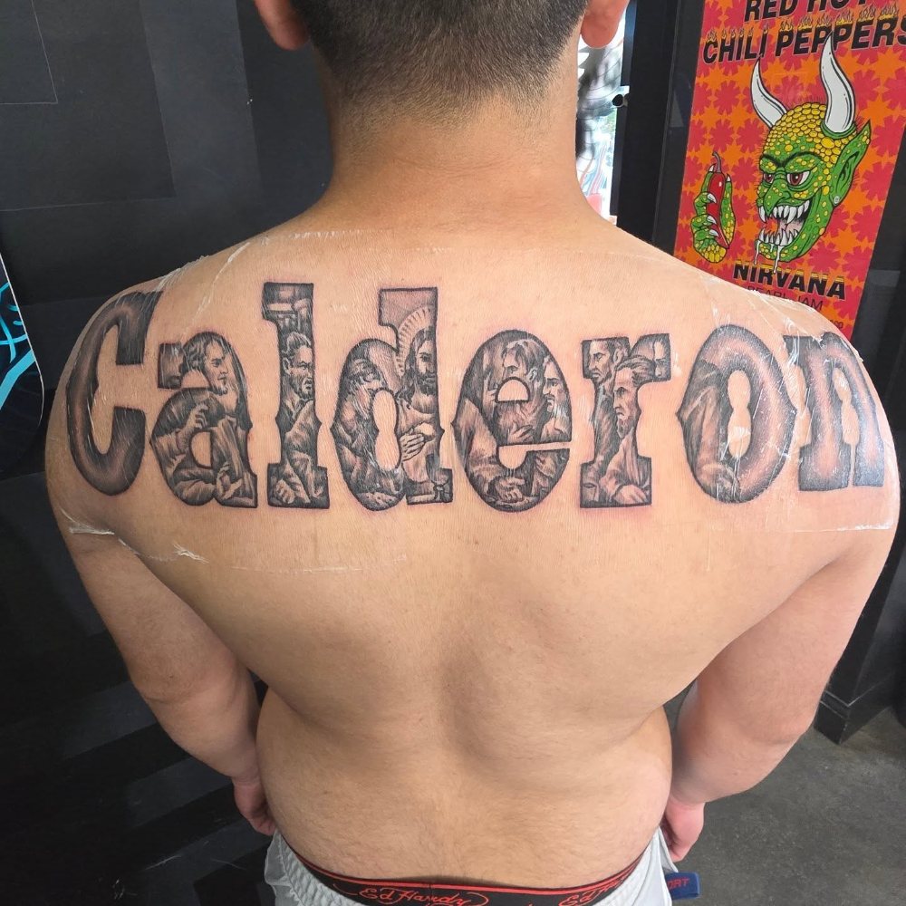 Family name lettering tattoo by Jason Lawson