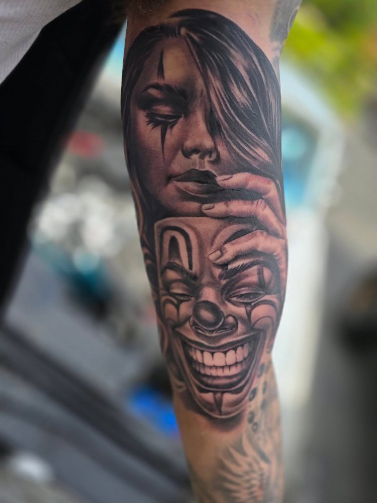 Woman & mask tattoo by Jason Lawson