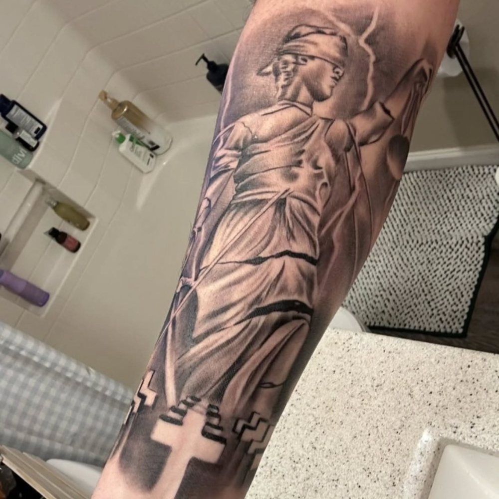 Winged angel tattoo by Jason Lawson