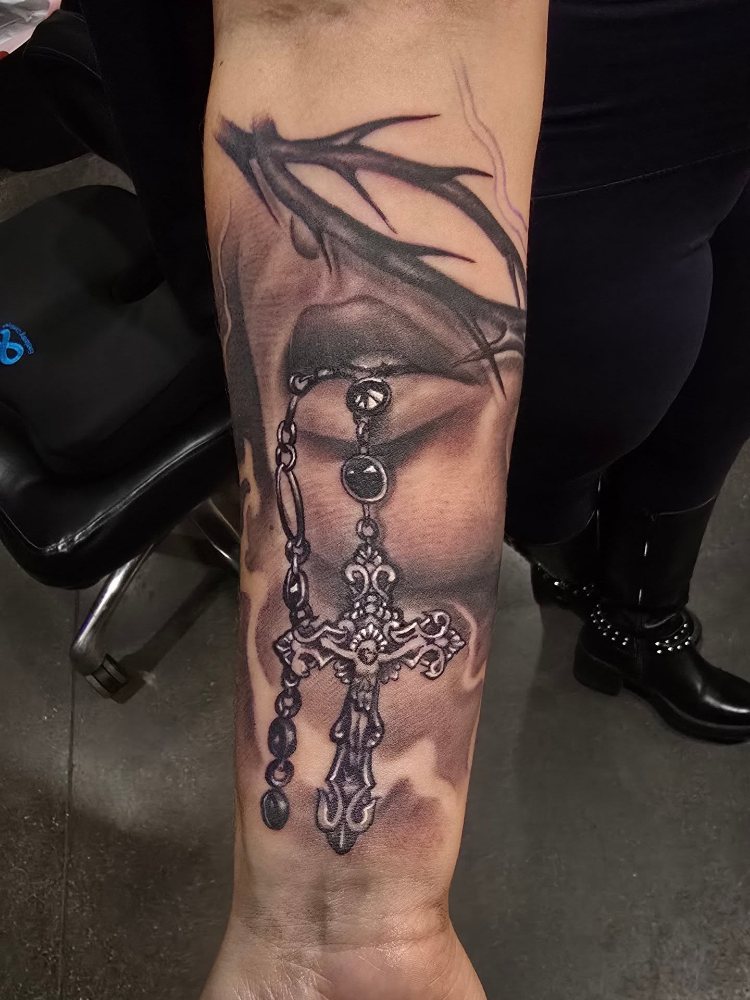 Rosary & swallow tattoo by Jason Lawson