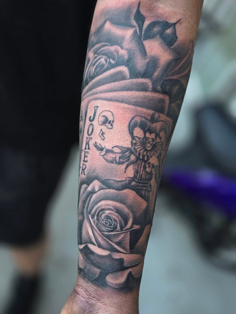 Joker card & roses tattoo by Jason Lawson