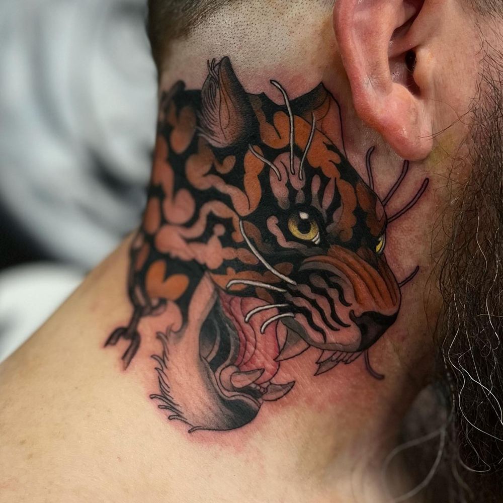 Tiger head tattoo by Marvin