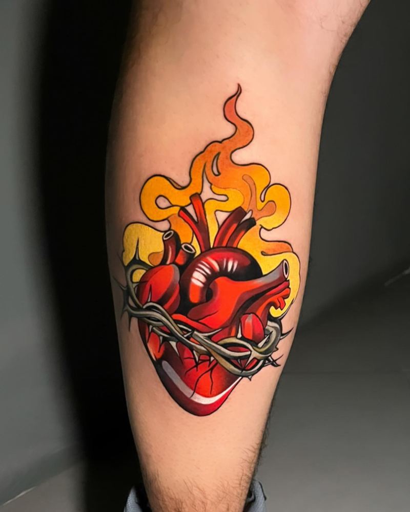 Flaming sacred heart tattoo by Sinai Alba